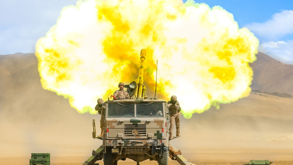 Wheeled self-propelled howitzers conduct a salvo