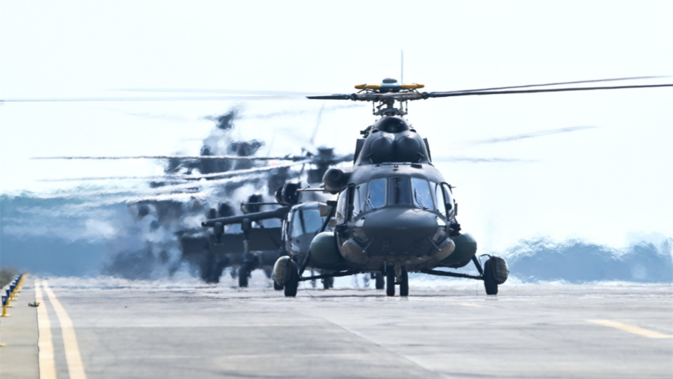 Multi-type helicopters engage in formation flight training
