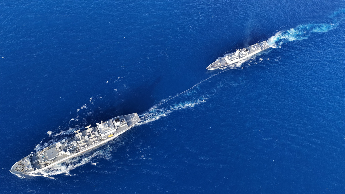 Naval vessels in astern replenishment-at-sea training