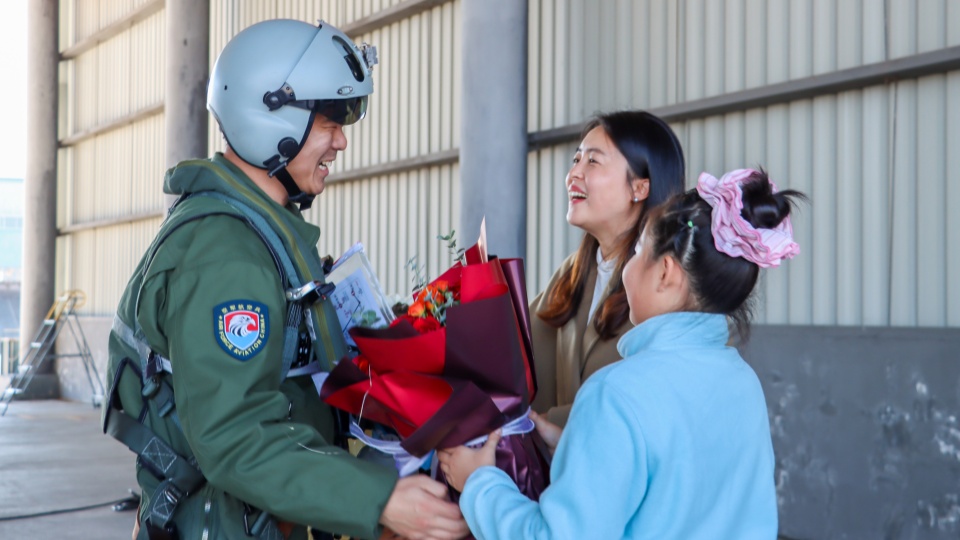 Pilot reunited with his family after training