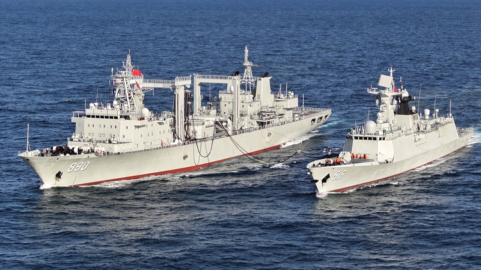 Naval vessels conduct replenishment-at-sea training