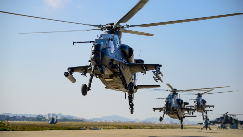 Multiple helicopters engage in flight training exercise