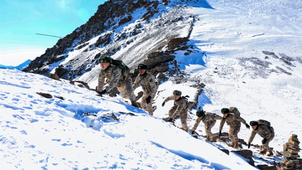 Soldiers patrol in mountainous border area