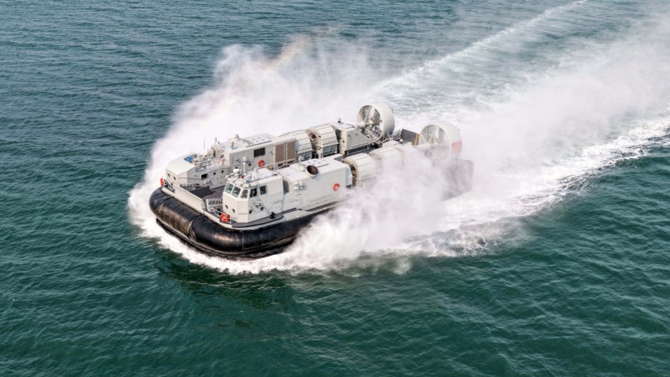 Landing craft air cushion kicks up spray