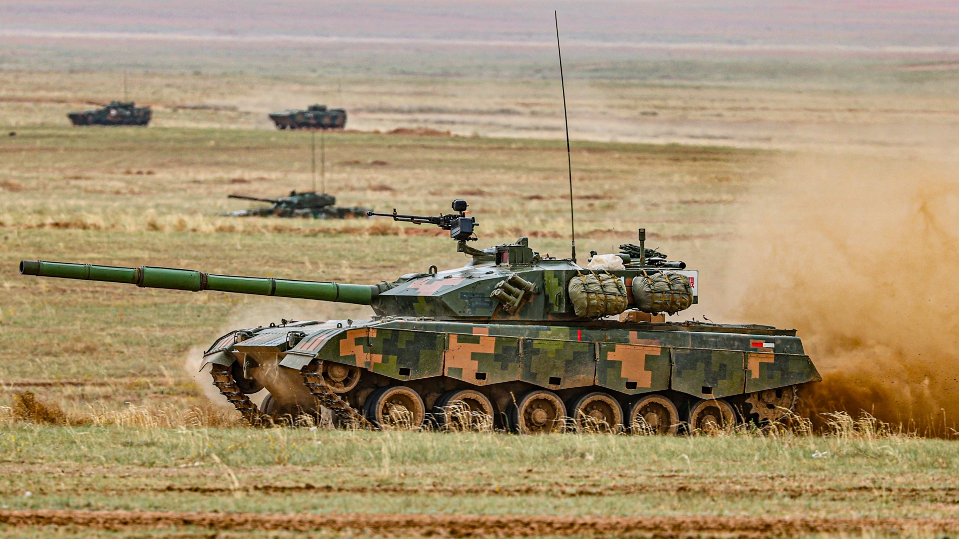 Tanks and infantry fighting vehicles in armored assault exercise