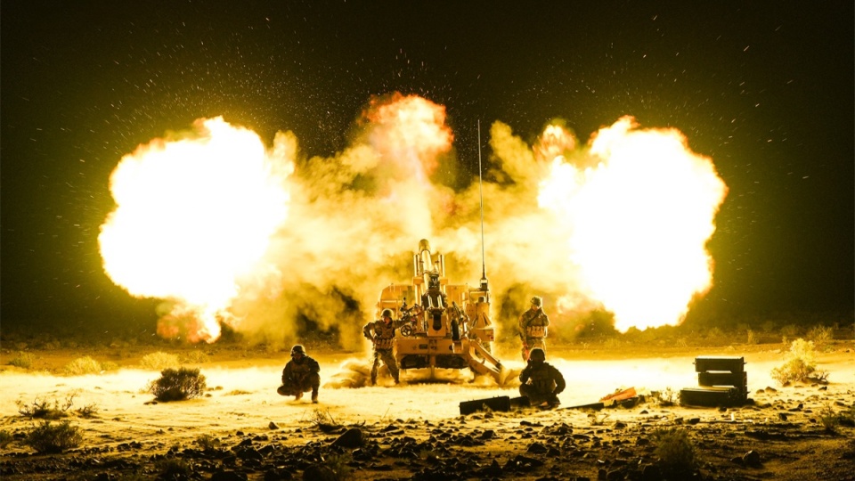 Self-propelled howitzer spits fire on plateau