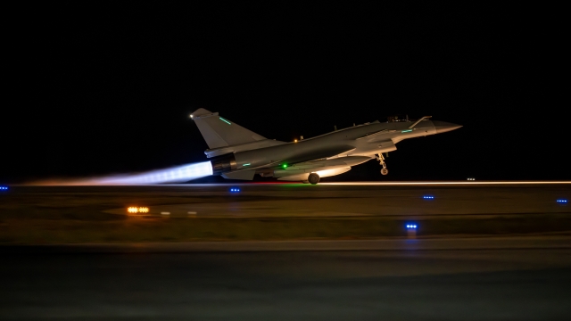 Fighter jet takes off at night