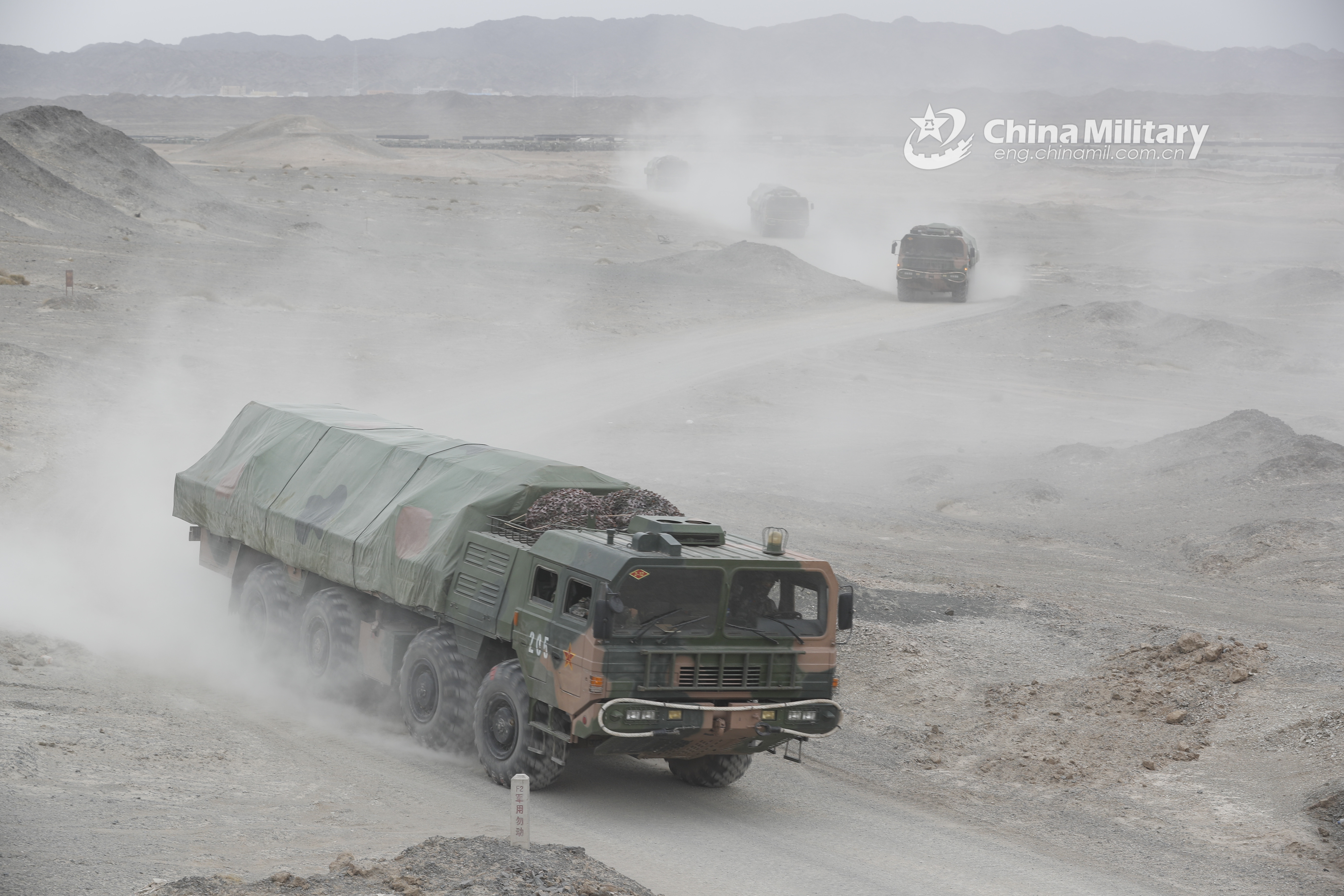 military truck convoy en route to training field