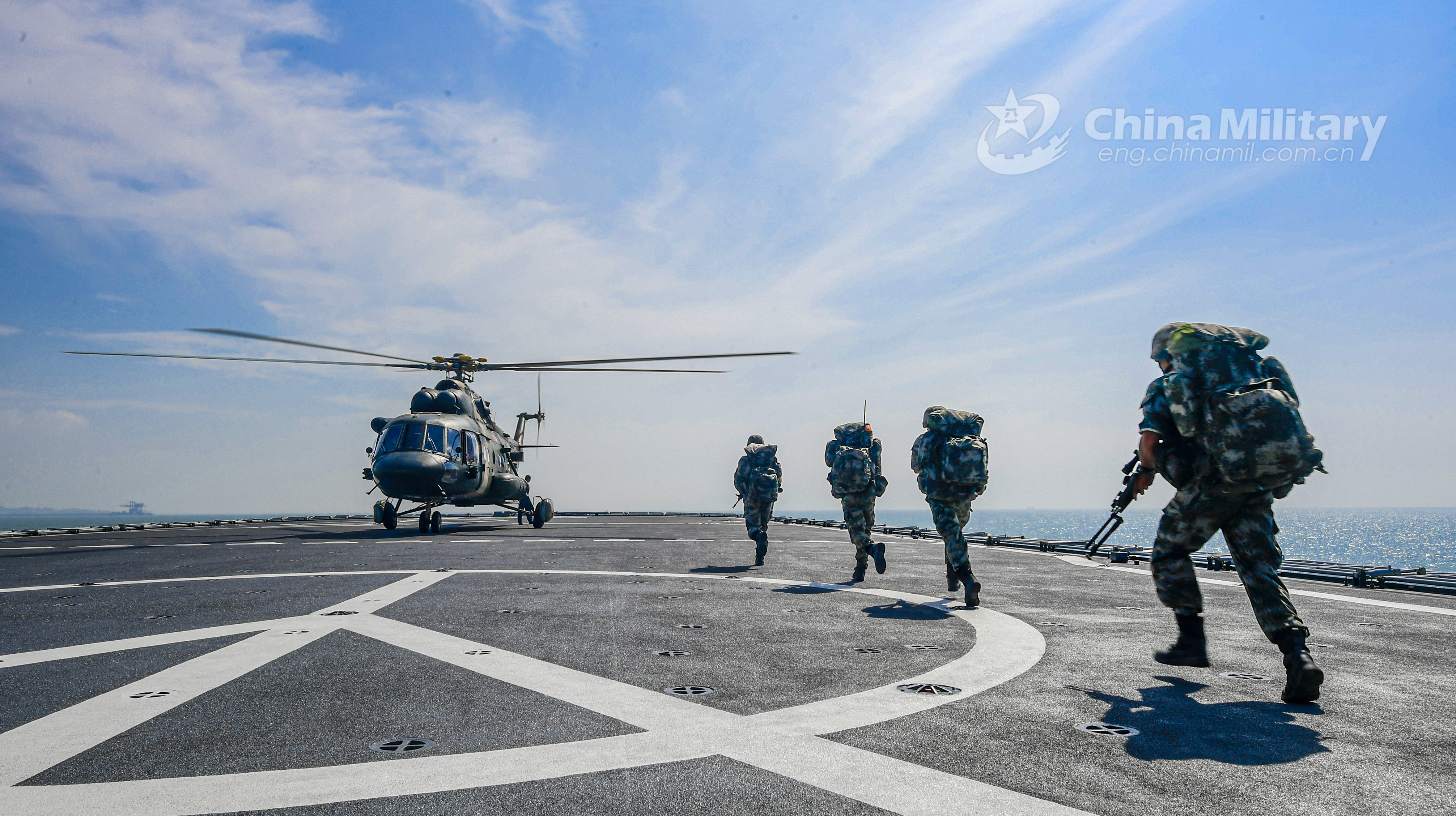 Army helicopters coordinate with naval landing ships in joint training -  China Military