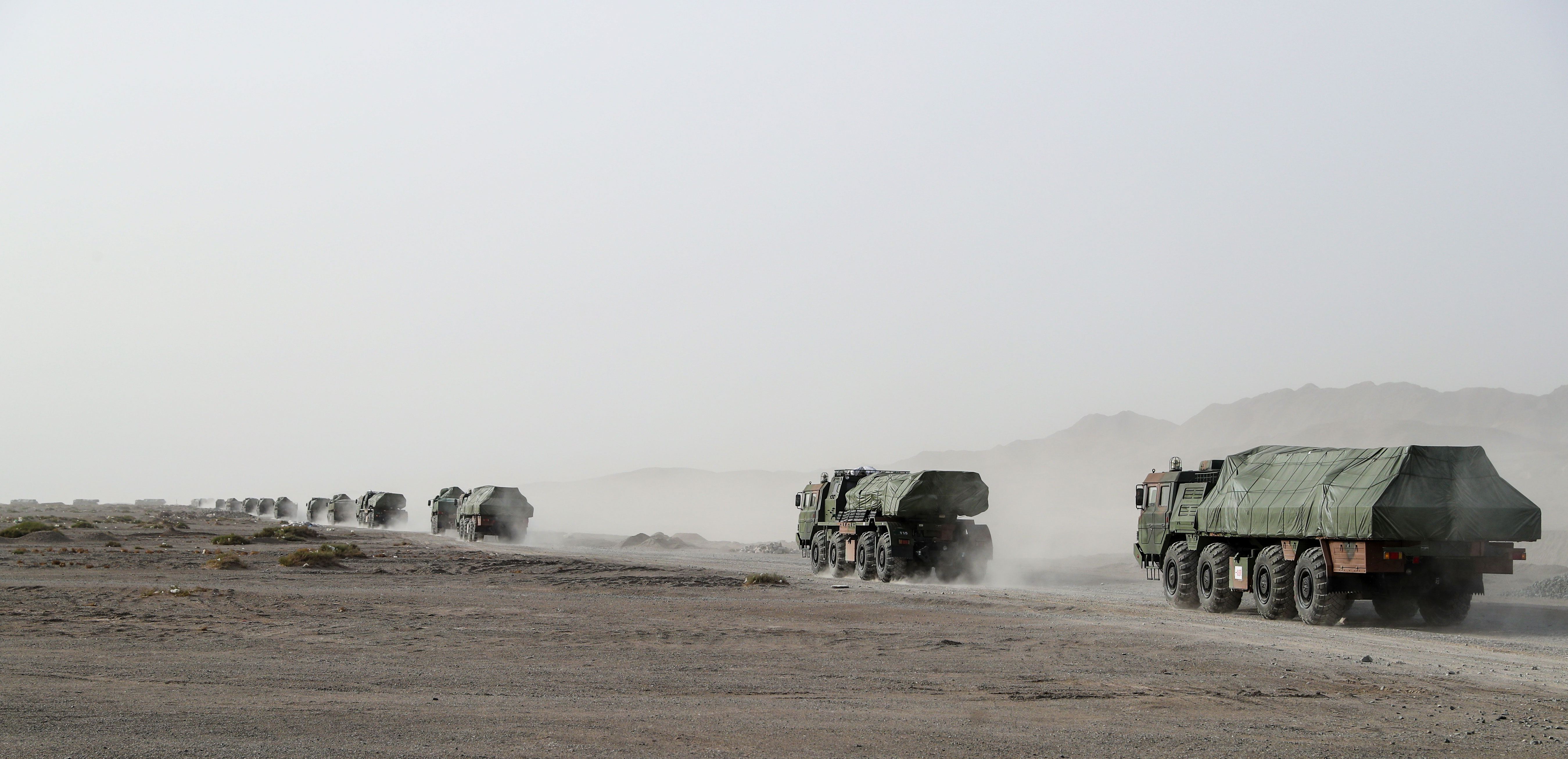 military truck convoy in long-distance maneuver