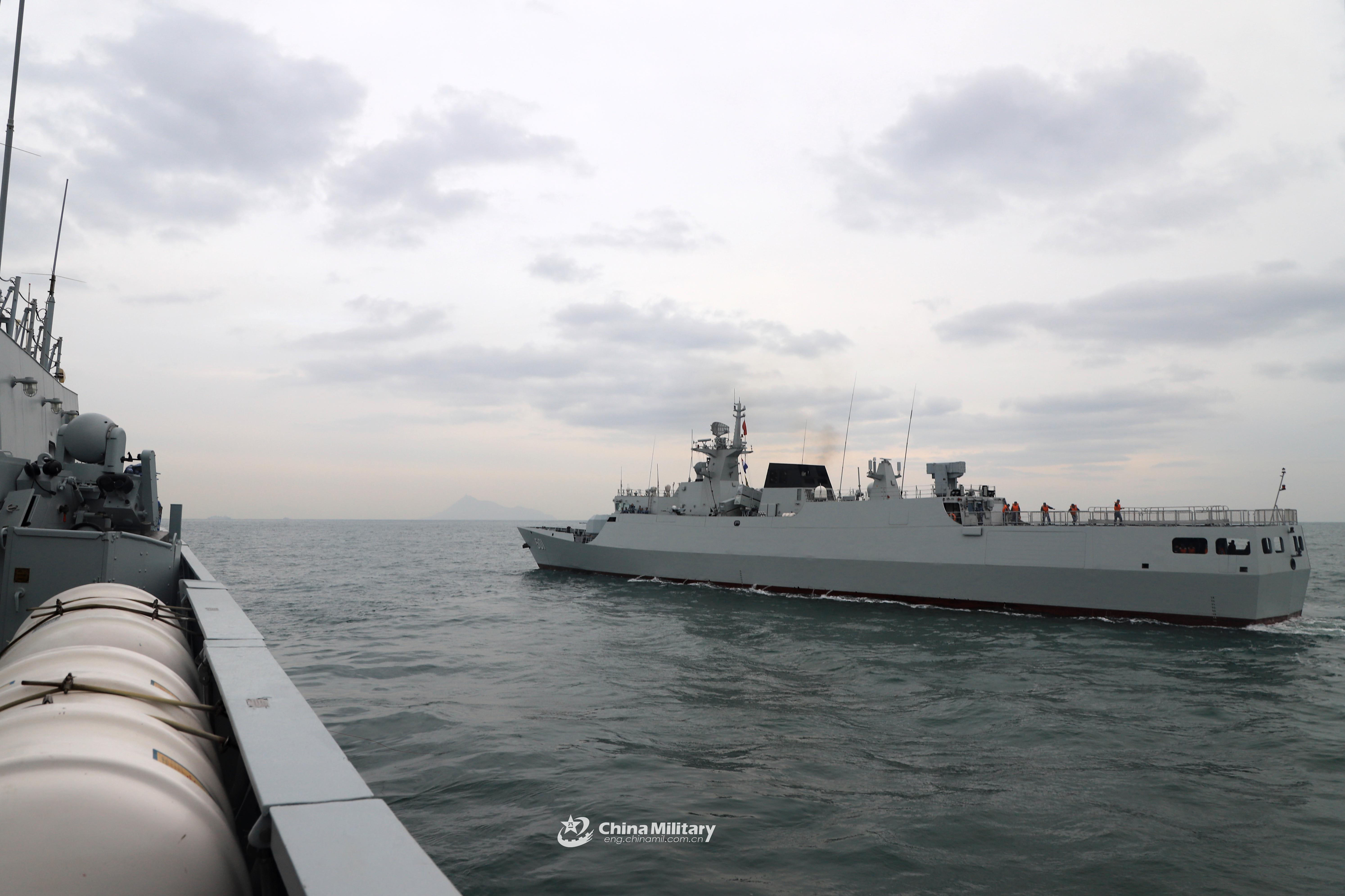 sailors heave the mooring lines aboard frigate