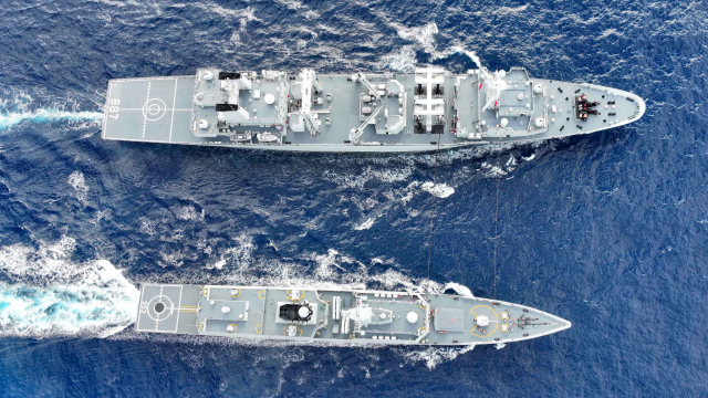 Naval vessels conduct replenishment-at-sea