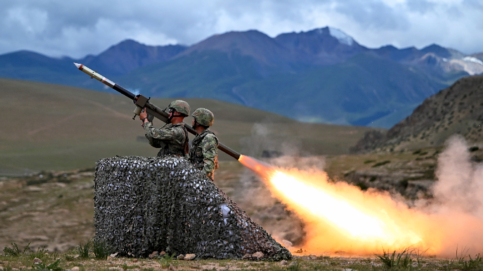 Soldiers fire man-portable shoulder-fired anti-aircraft missile system 